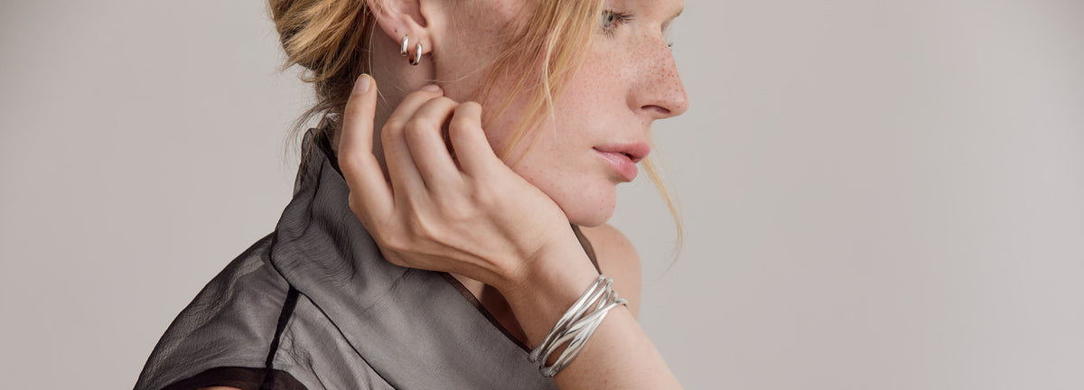 Willa wearing sculptural jewelry from the Möbius Collection.