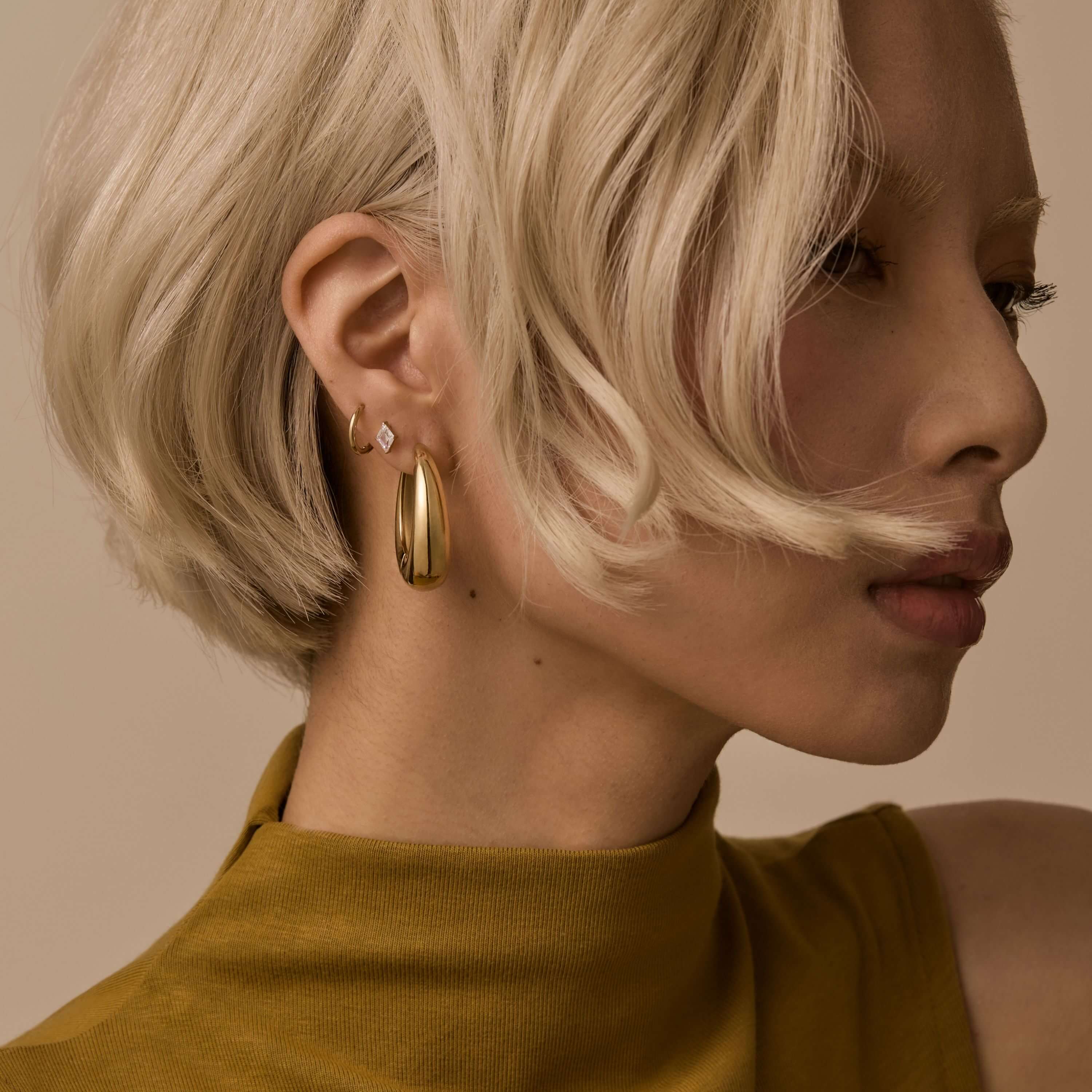 Oeuf Hoops and Classic Huggie Hoops, 11mm with Celestial Crystal Lozenge Nap Earrings on Model