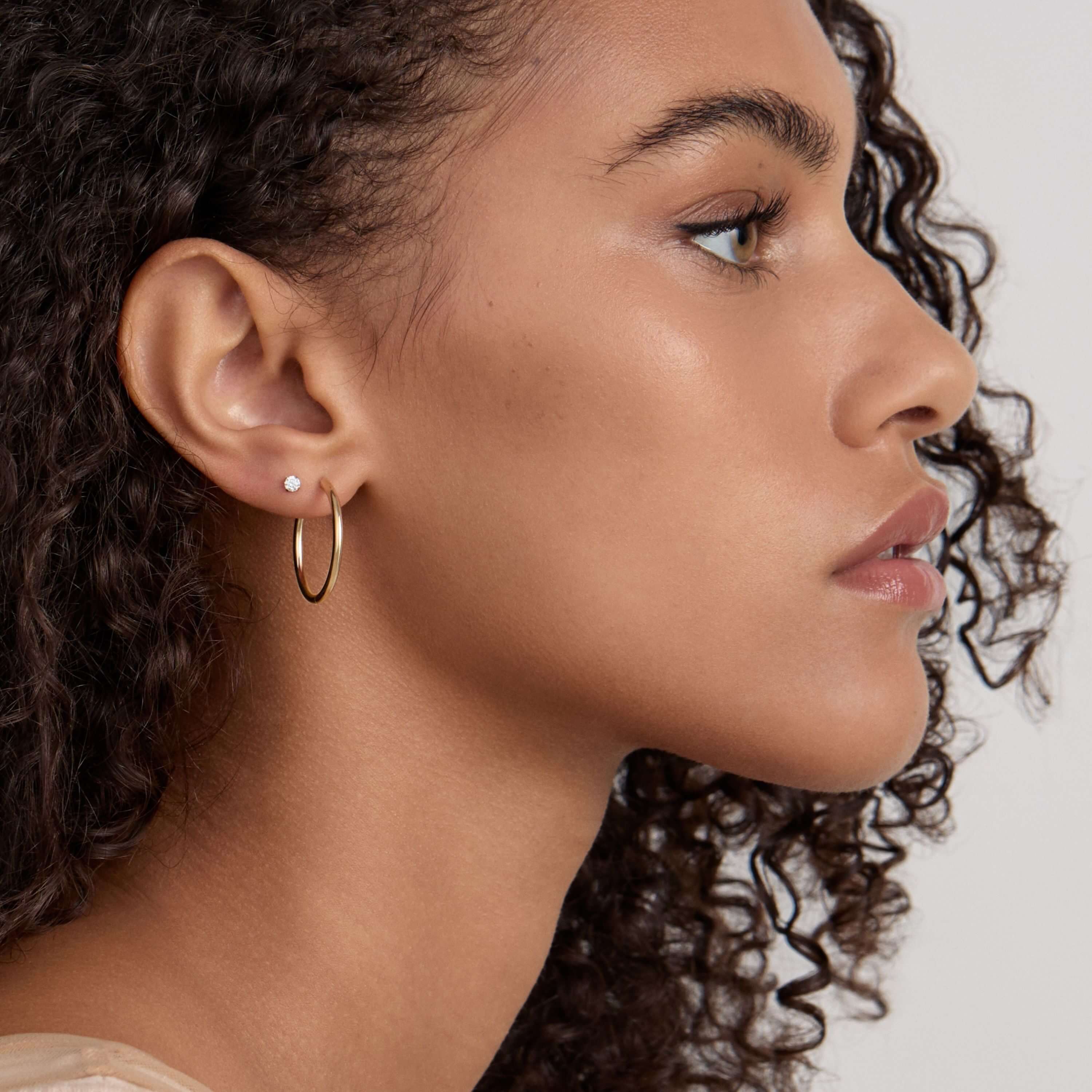 Classic Hoops, 25mm and Celestial Crystal Solitaire Nap Earrings, 3mm on Model