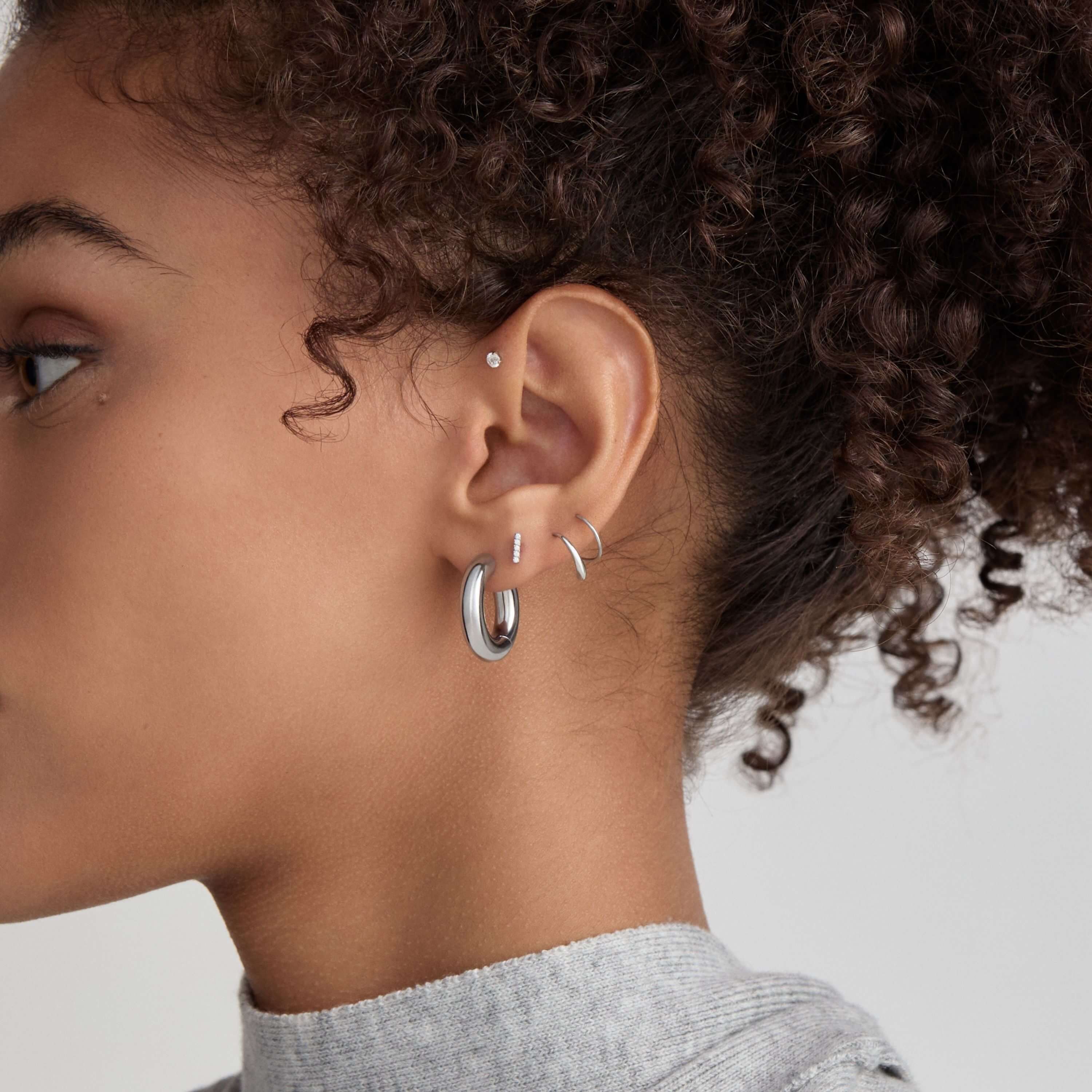 Every Body Hoops, 22mm and Twirl Hoops with Pave Bar Nap Earrings on Model