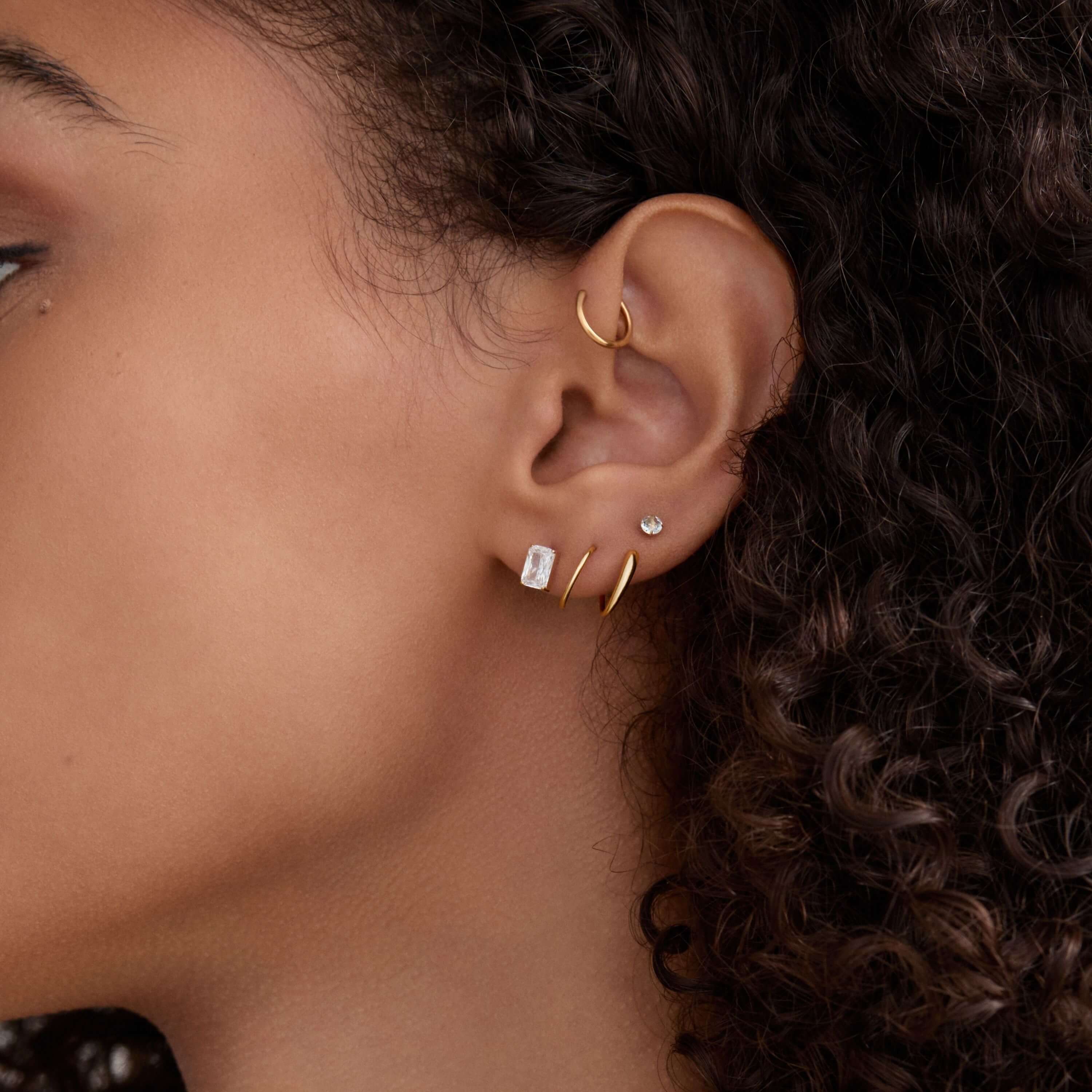 Celestial Crystal Emerald Cut, 6mm and Aquamarine Nap Earrings with Classic Cartilage and Twirl Hoops on Model