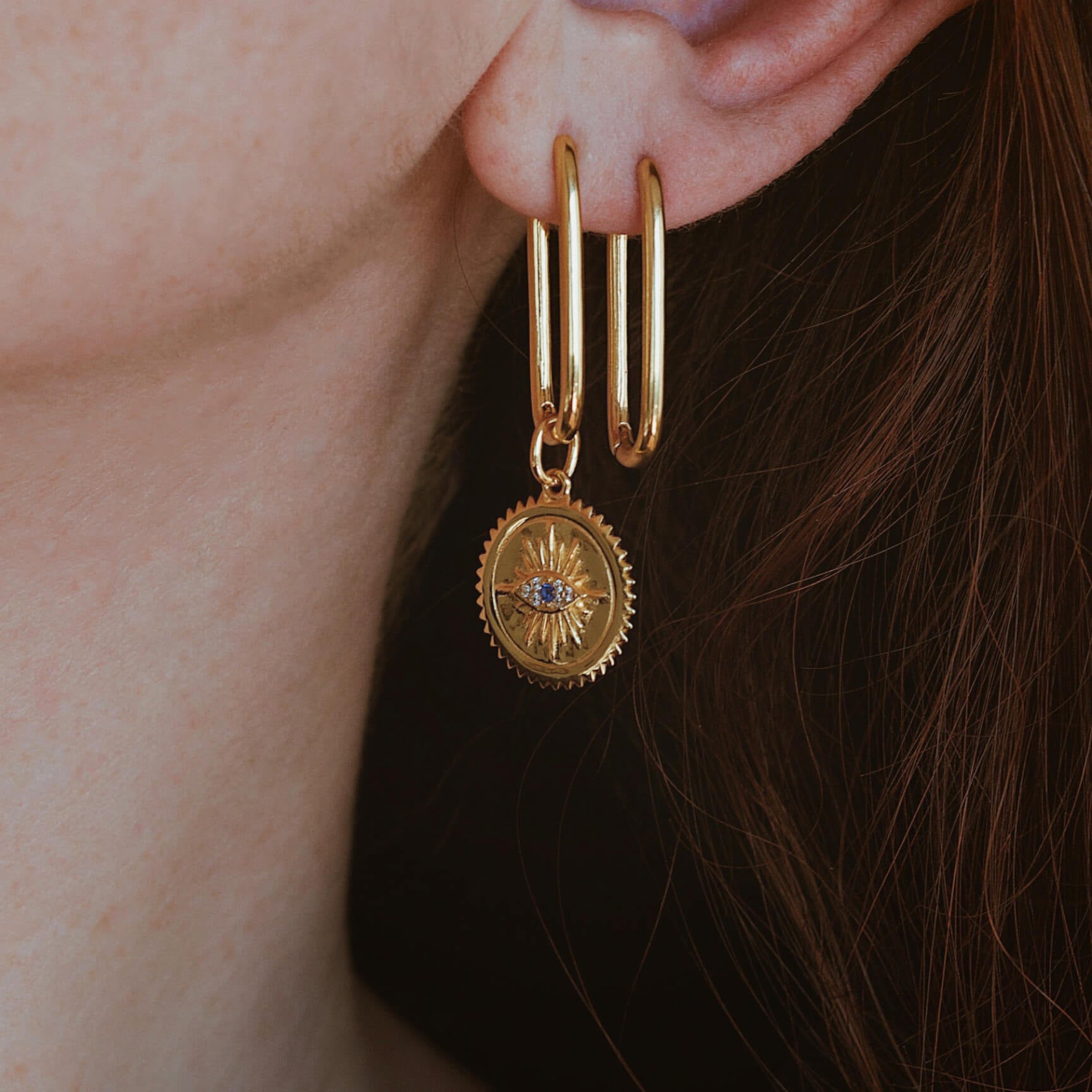 @eleonoraarico wearing Halo Oval Hoops with Evil Eye Medallion Charm