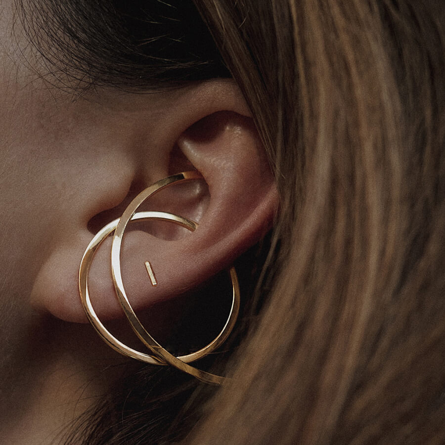 @thewhiteocean wearing Little Bar Studs and Illusion Hoops