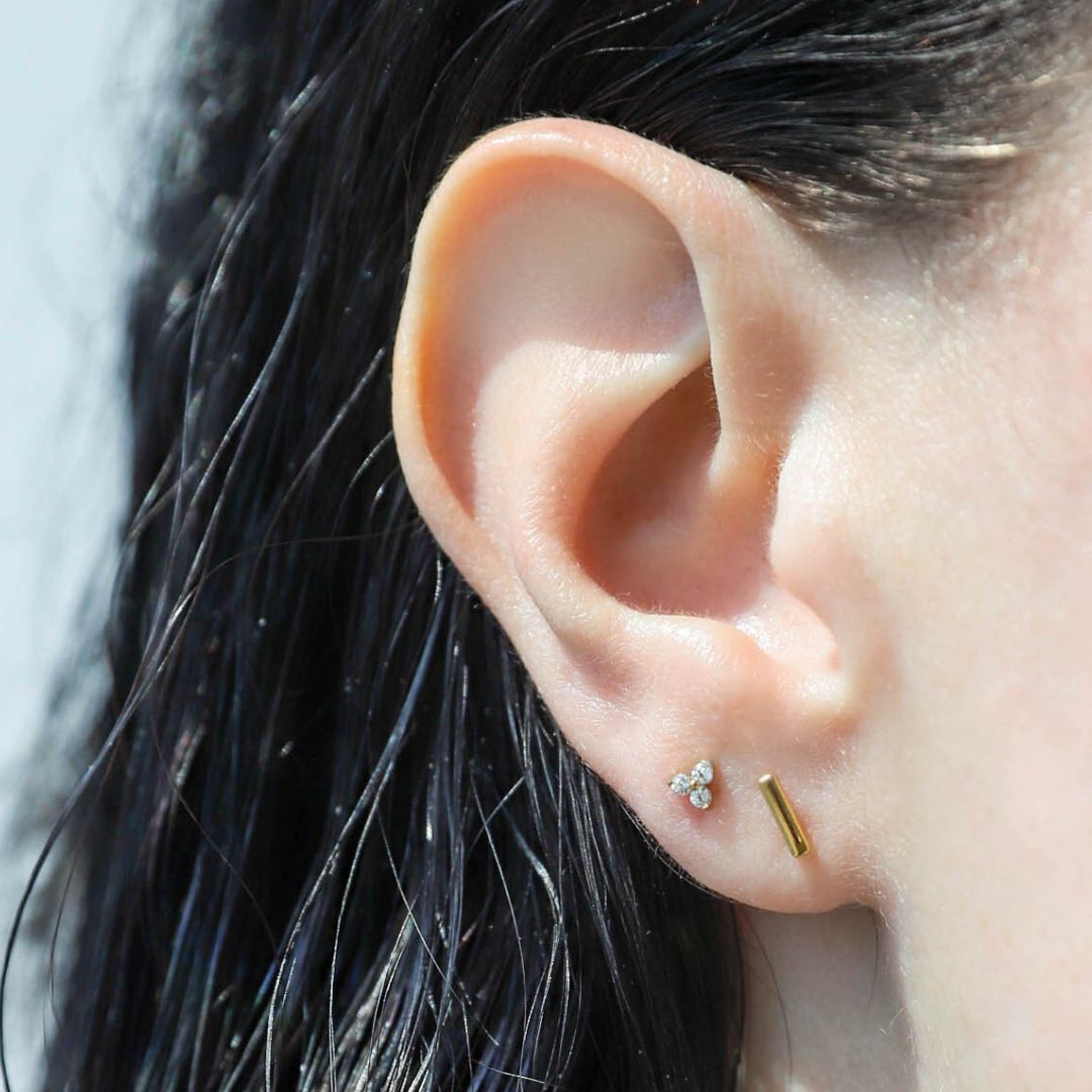 Mini Crystal Trinity Studs in Titanium on model (Gold)