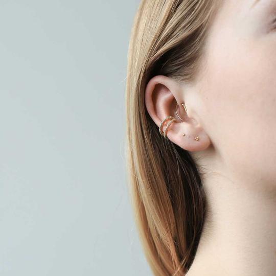 Tiny Trinity Threaded Flat Back Earring in 14k Gold on model