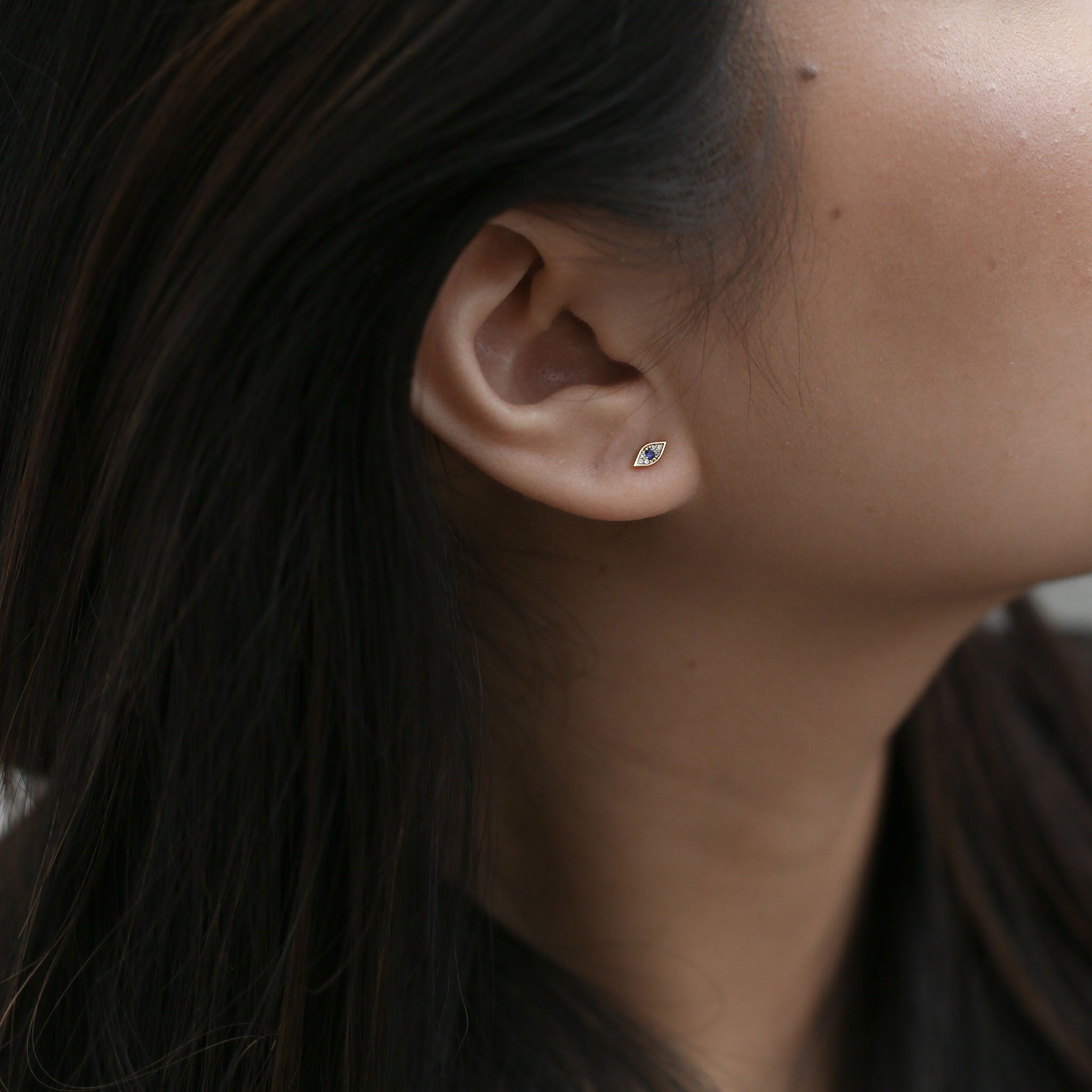 Evil Eye Studs in 14k Gold on model