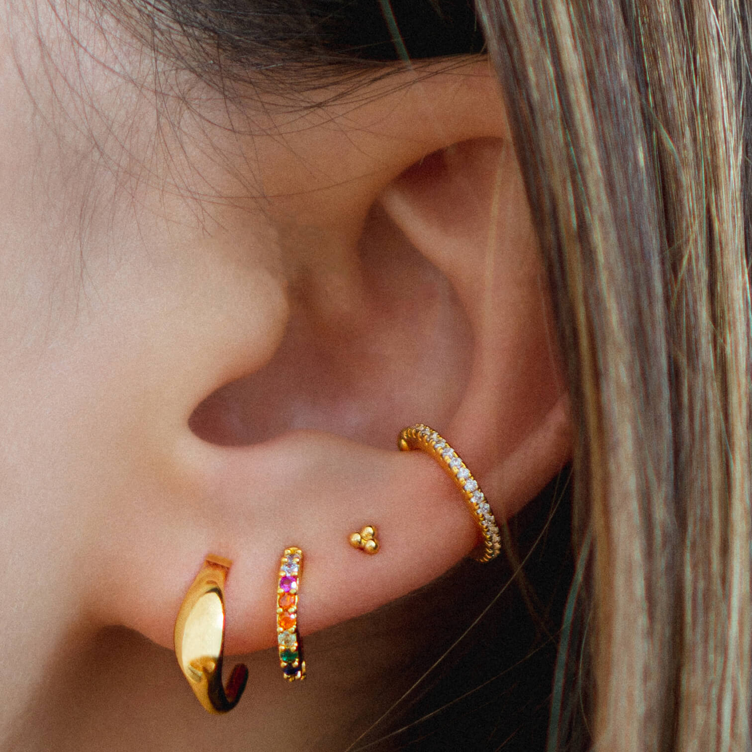 Tiny Trinity Ball Back Earrings in 14k Gold on model