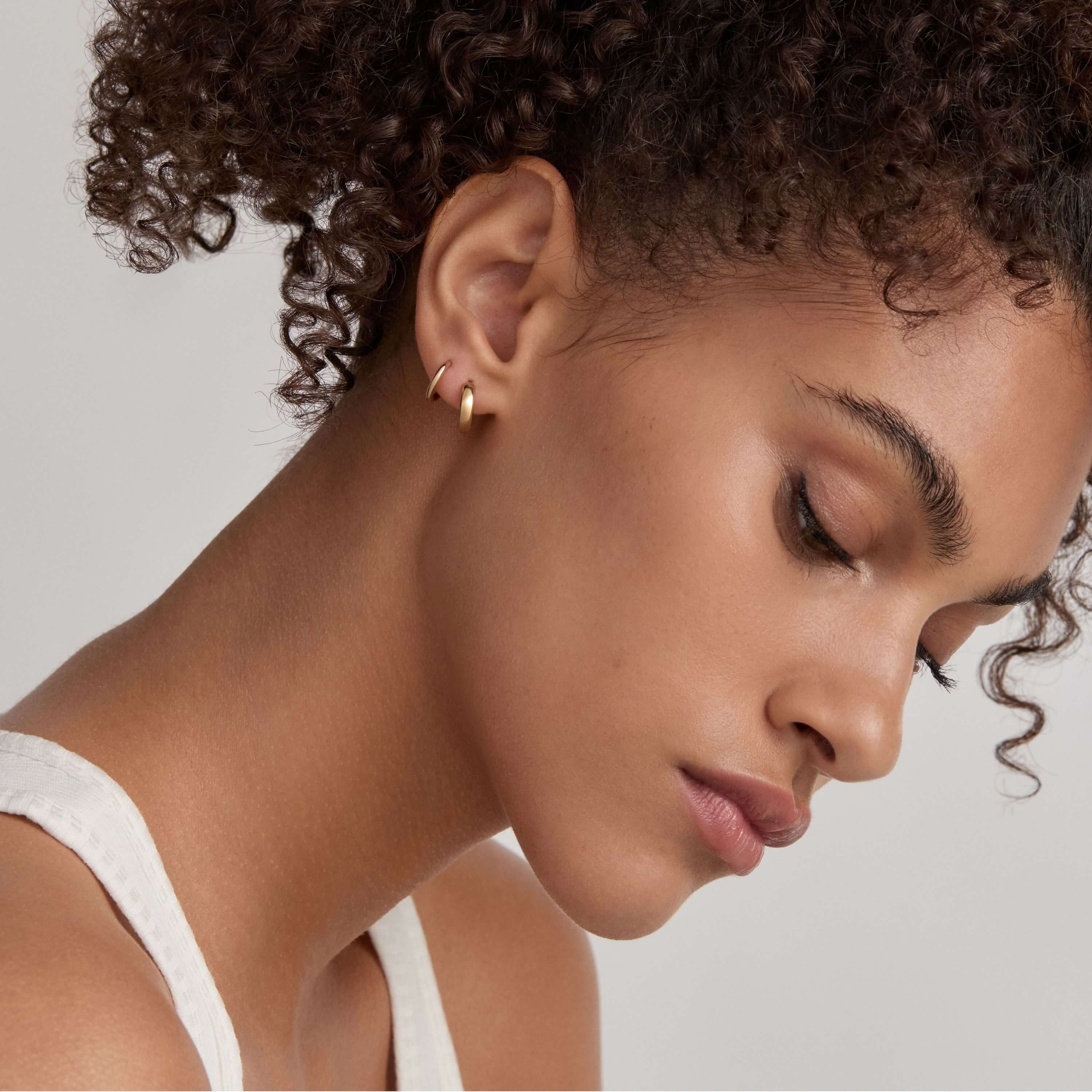Classic Huggie Hoops, 11mm and Bold Huggie Hoops, 12mm on Model