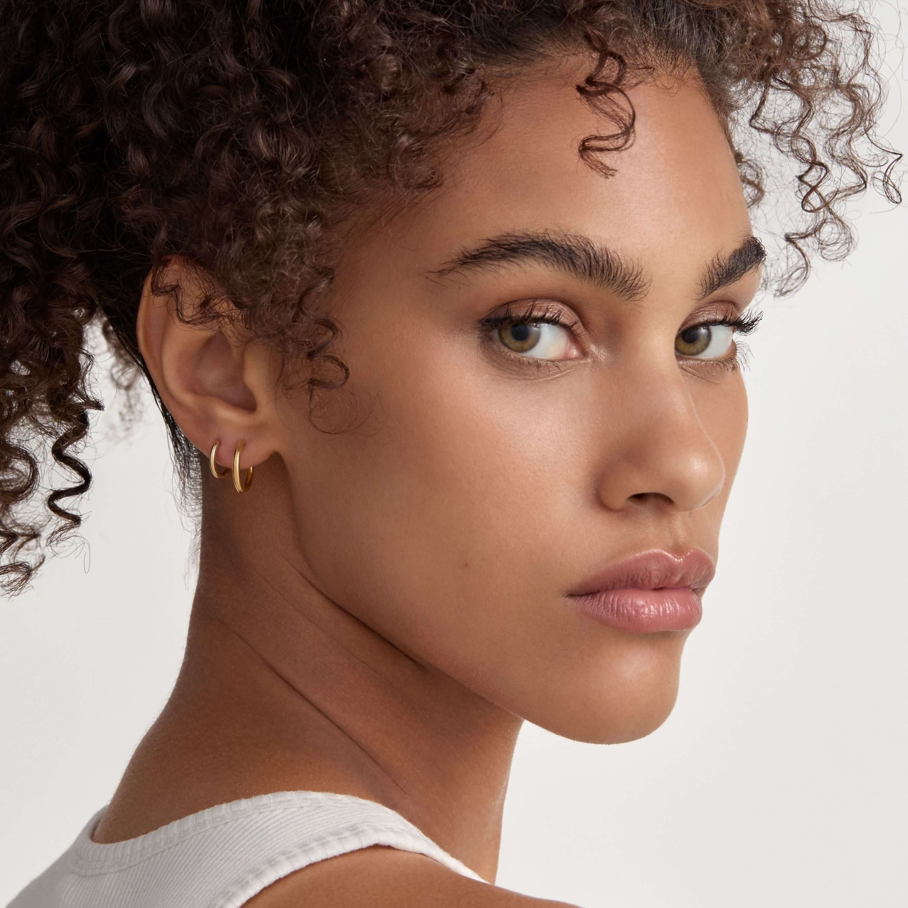 Classic Huggie Hoops, 11mm and Bold Huggie Hoops, 12mm on Model