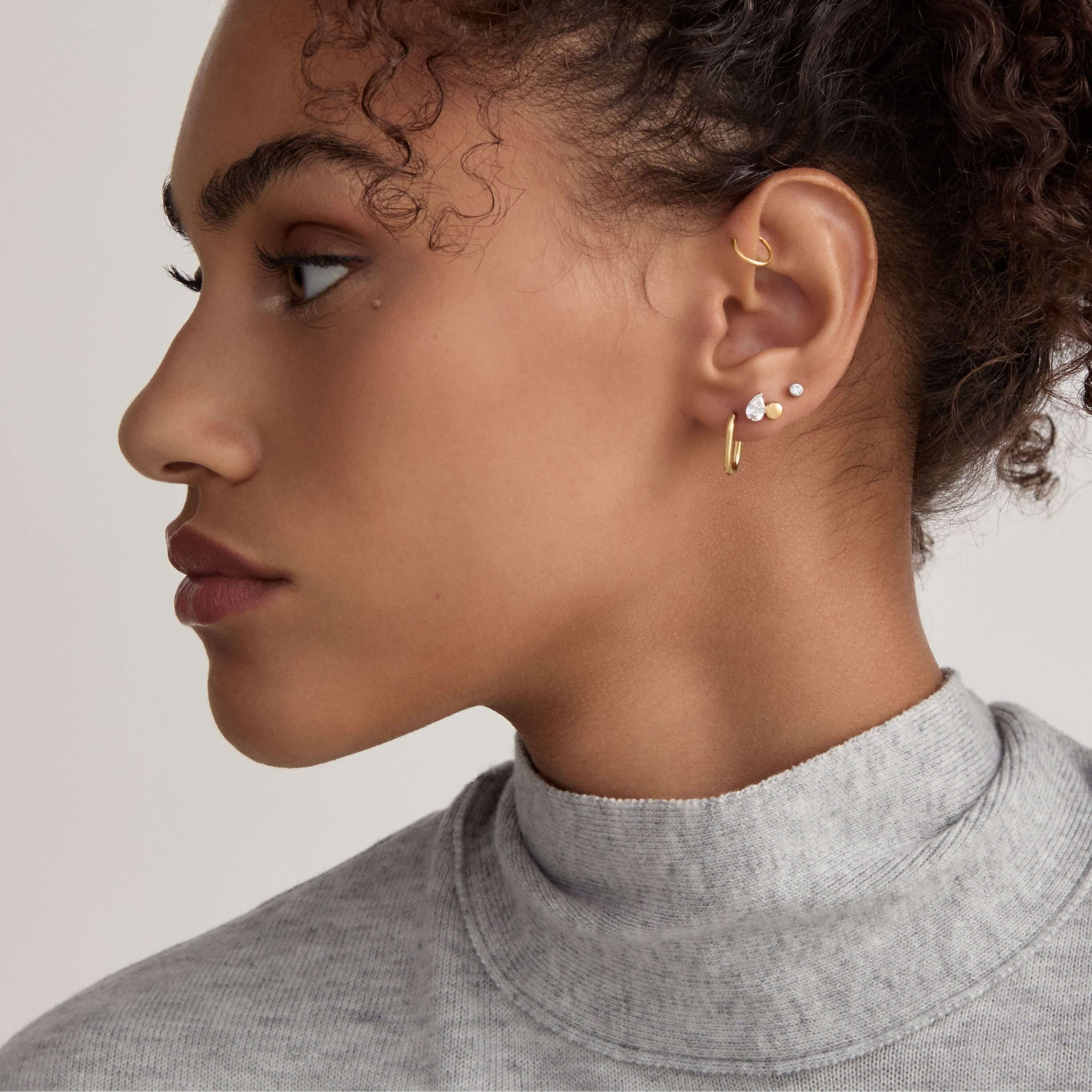 Classic Cartilage Hoop and Halo Oval Hoops, 15mm with Toi Et Moi and Celestial Crystal Bezel Solitaire Nap Earrings on Model