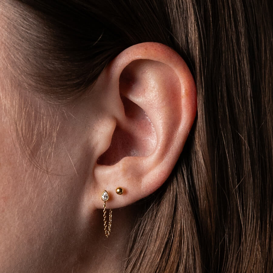 Little Sphere Studs in Titanium (Gold) on model