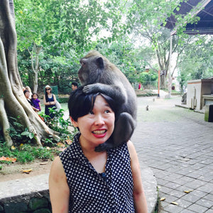 Founder and Creative Director Trisha with a monkey on her head