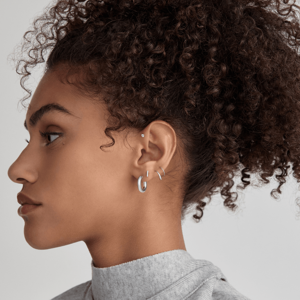 Every Body Hoops, 18mm with Classic Twirl Earrings and Pave Bar Nap Earrings on Model - Silver