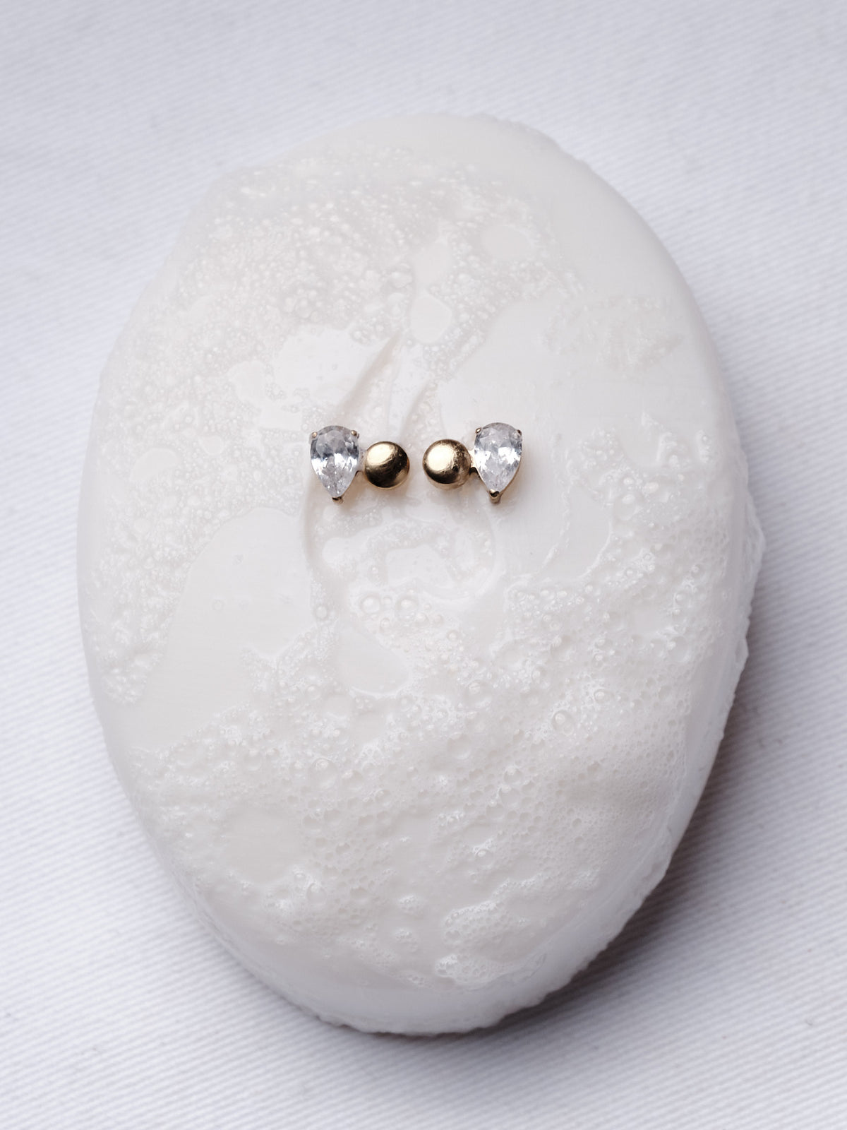 Toi et Moi earrings on a pale stone