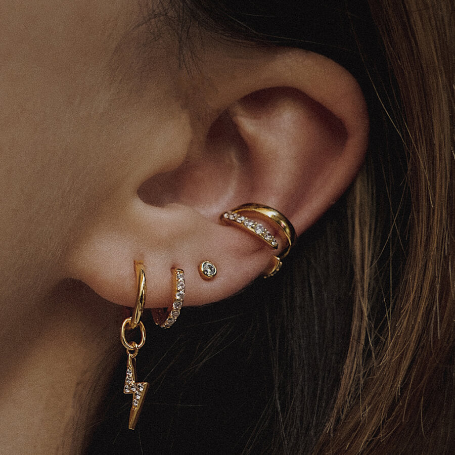 @thewhiteocean wearing lightning bolt jewelry