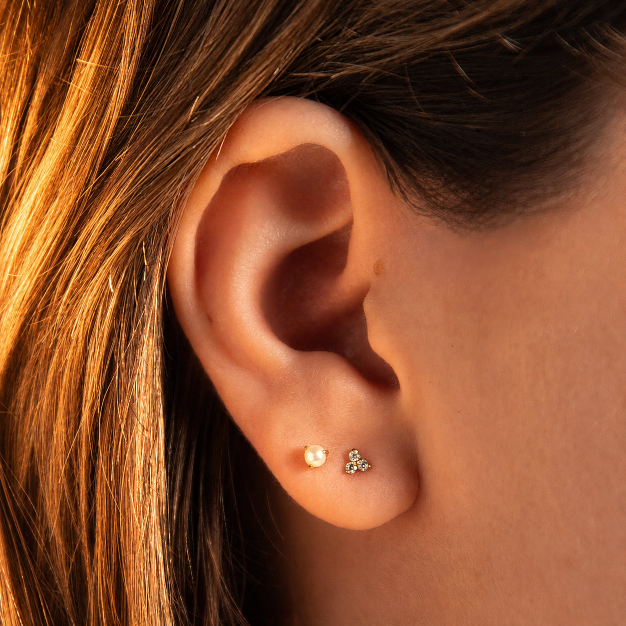 Pearl Nap Earring, 3mm and Crystal Trinity Nap Earrings in (Gold) on model