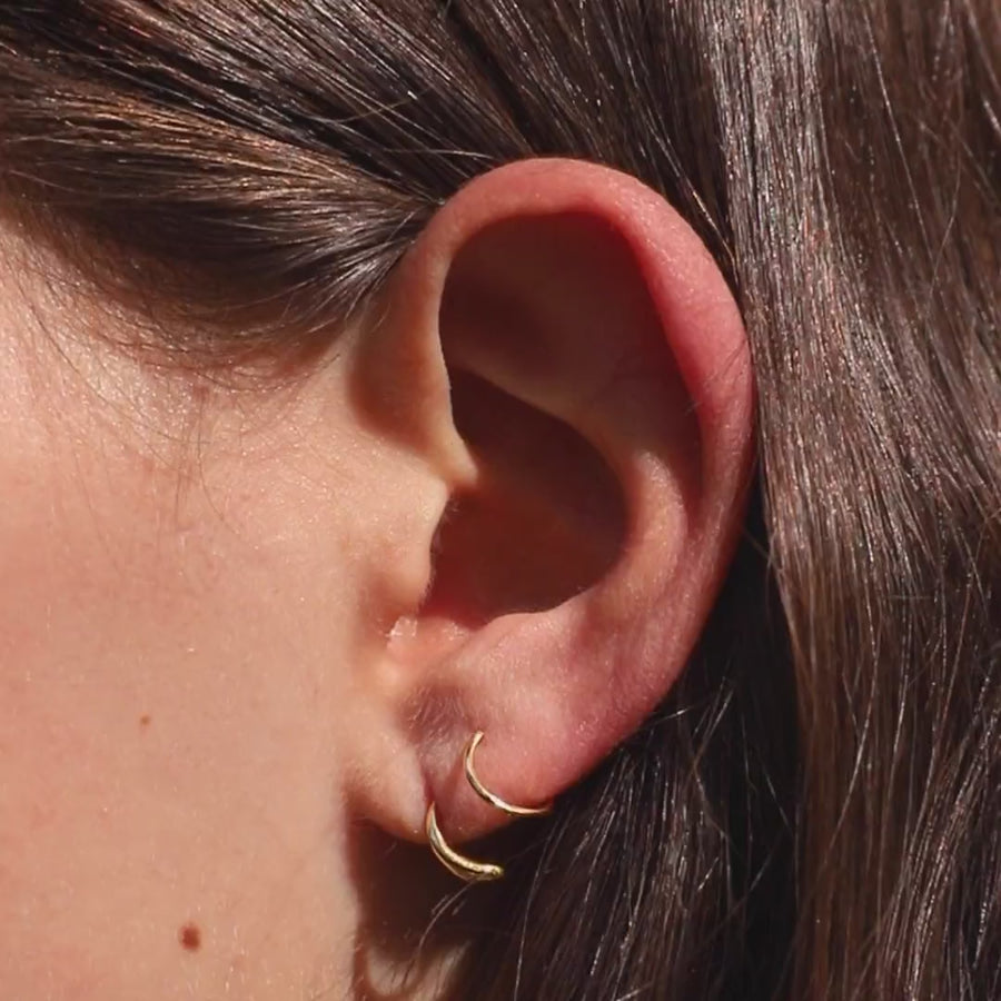 Classic Twirl Earrings in Titanium on model video (Gold)