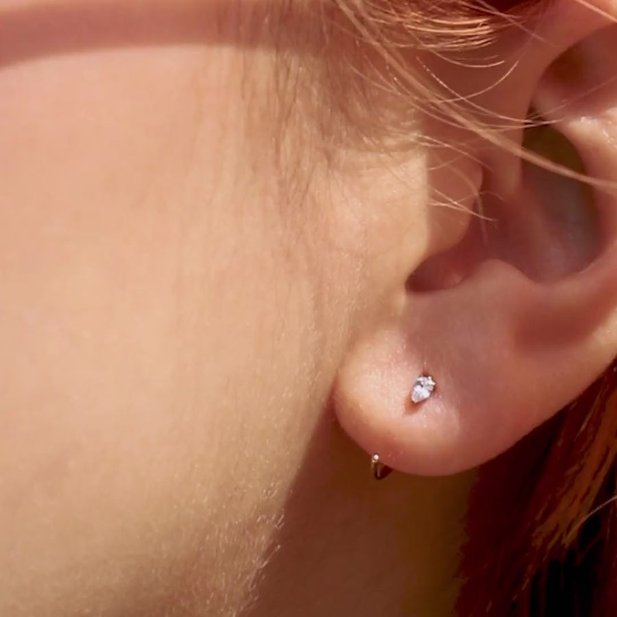 Dewdrop Huggie Earrings in Titanium (Gold) on model video