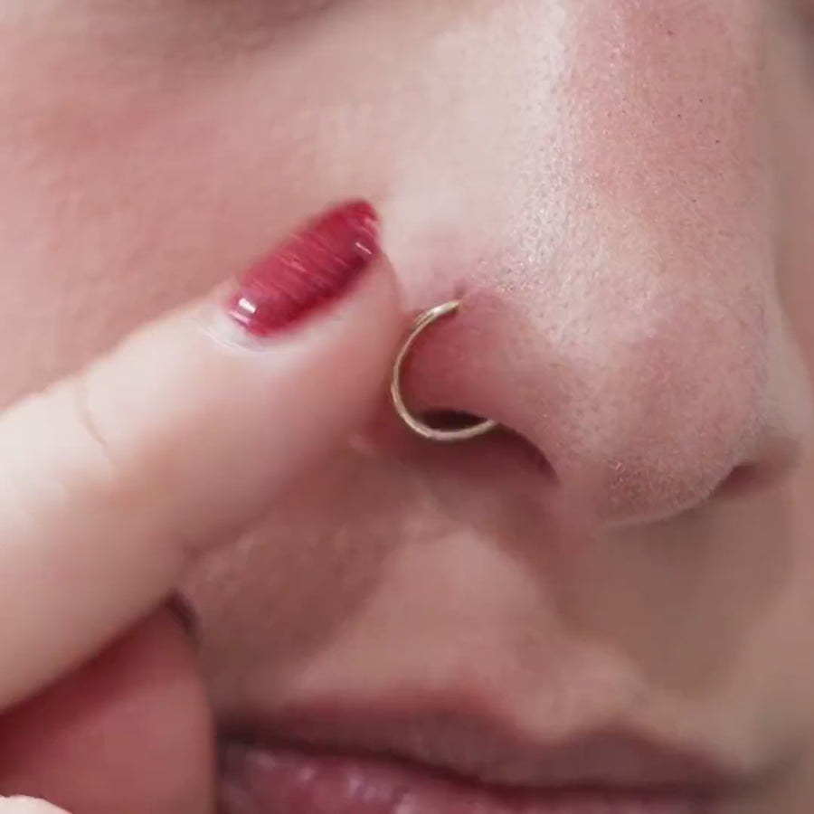 Tiny Secret Nose Hoop Ring in 14k Gold (8mm) on model video