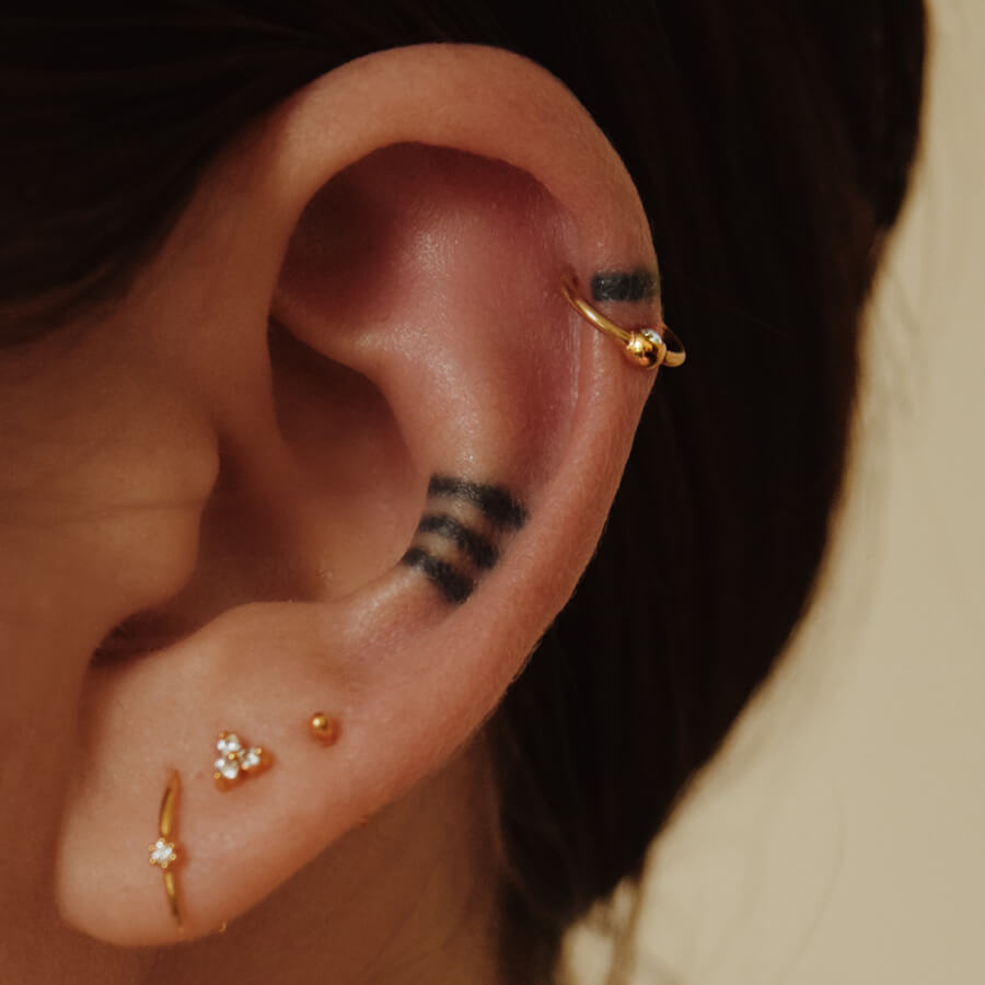 @sometimesbutno wearing trinity and sphere jewelry