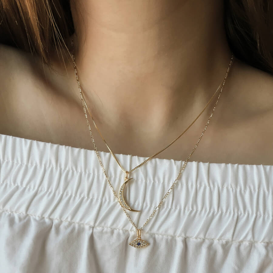 @sonyavoh wearing the Pave Moon Charm Necklace and Evil Eye Charm