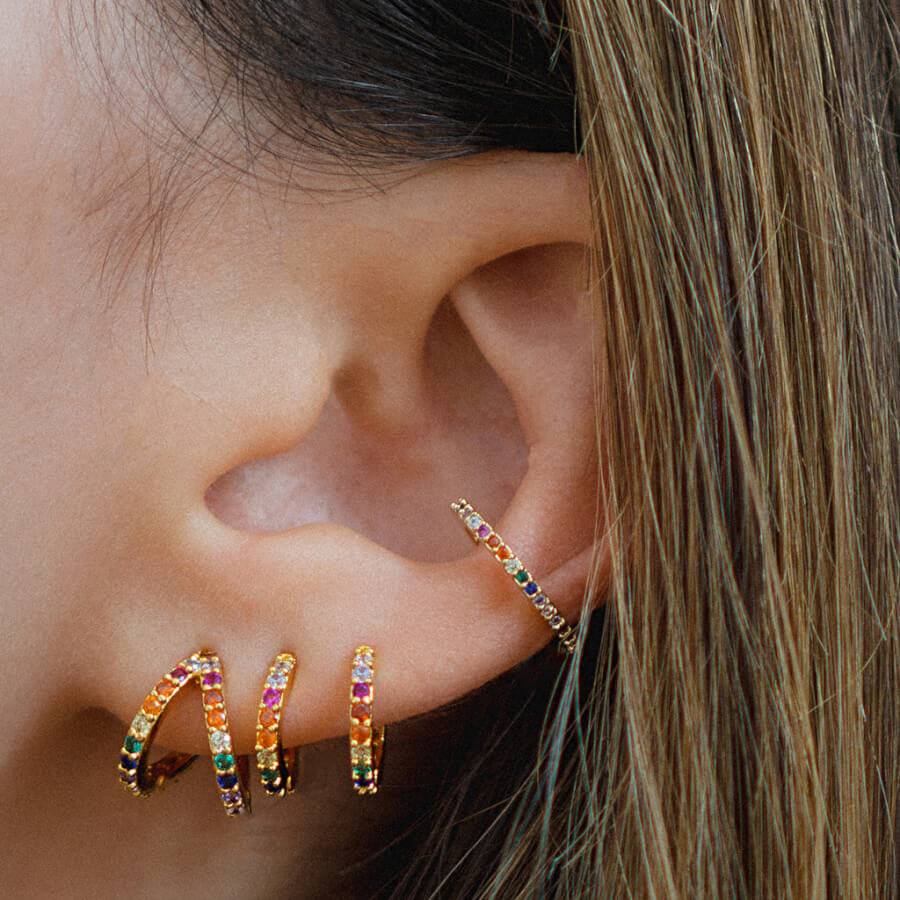@thewhiteocean wearing Rainbow Infinite Huggies and Eternity Ear Cuff