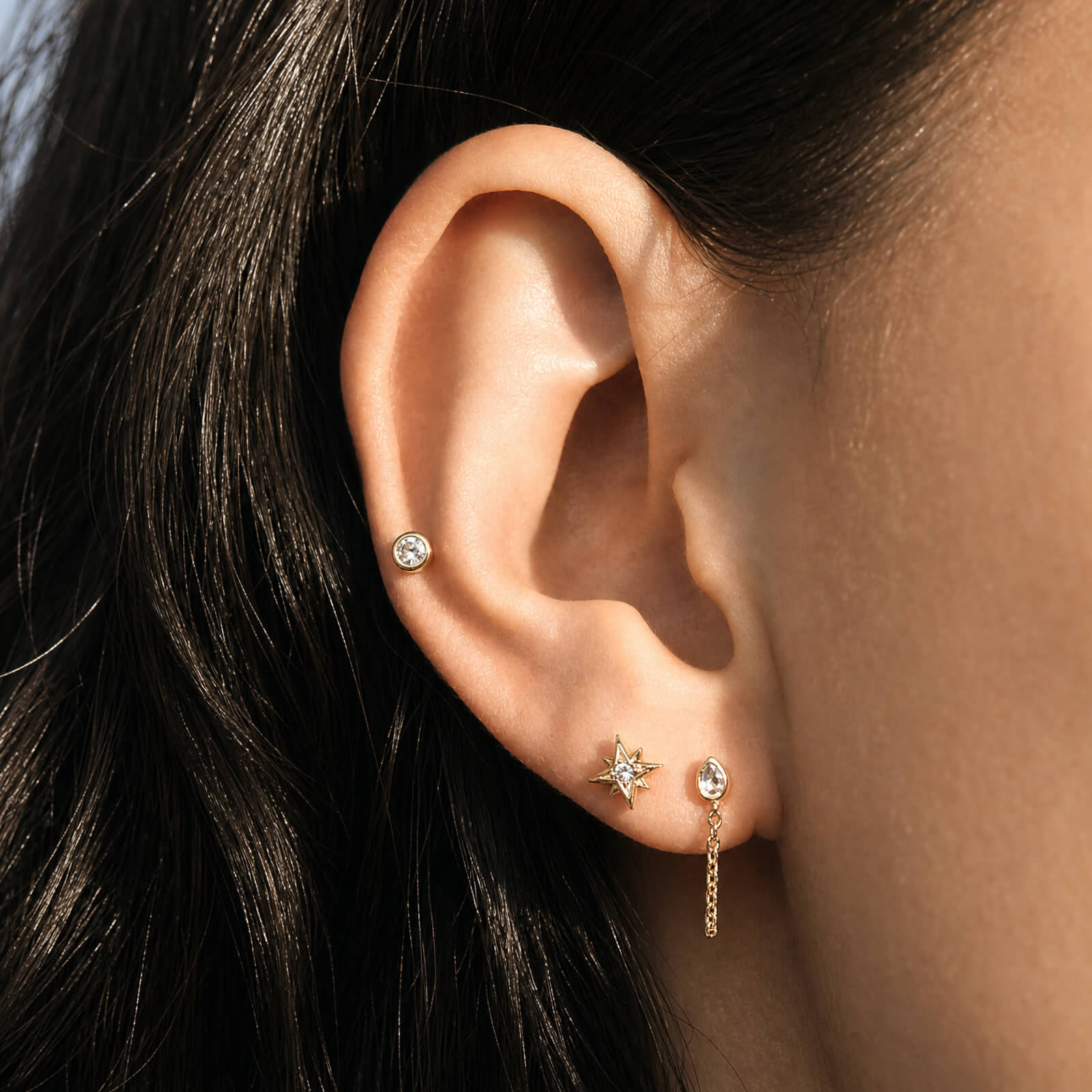 North Star and Bezel Pear Nap Earrings and Celestial Crystal Bezel Solitaire Threaded Flat Back Earring (Titanium - Gold) on model