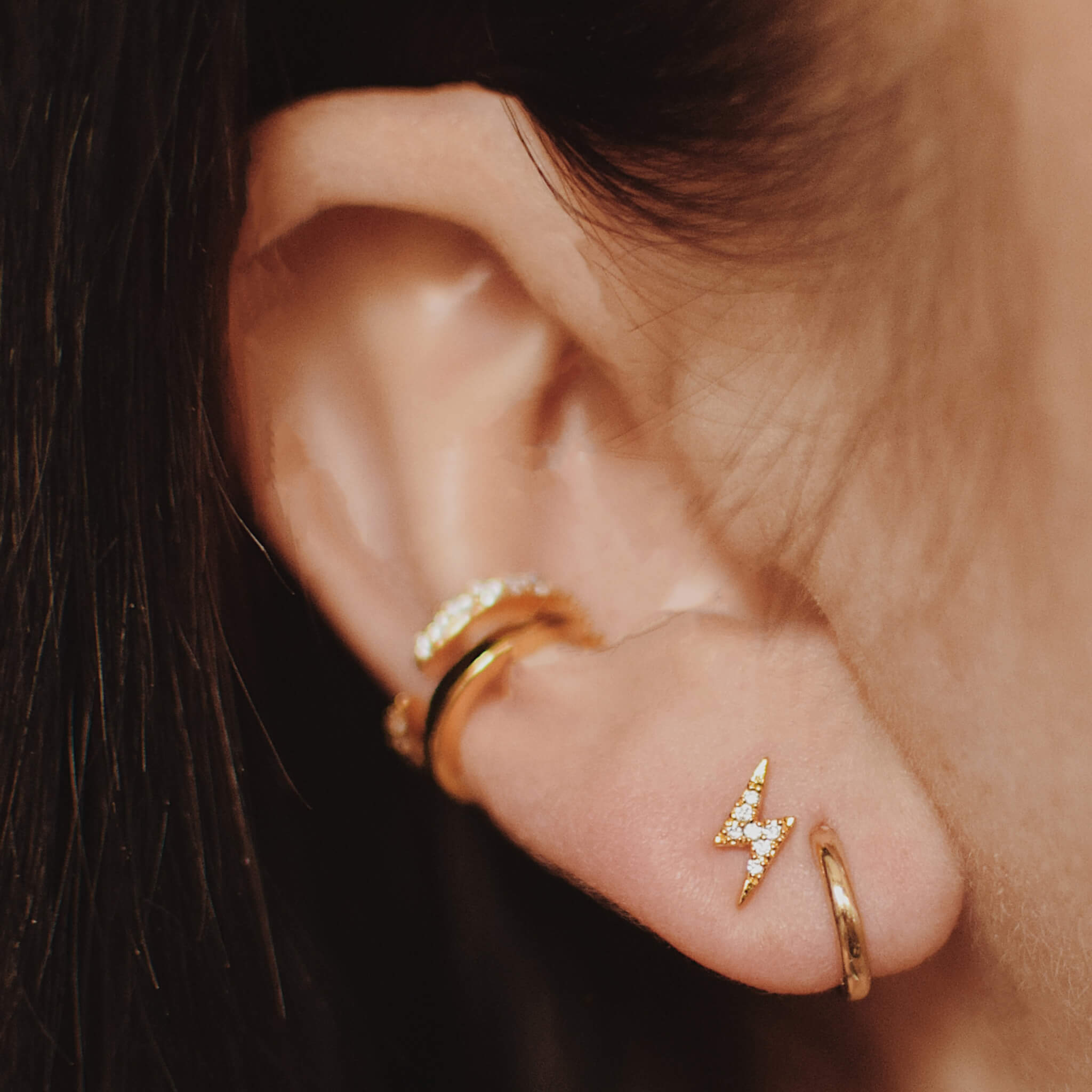 Classic Huggie Hoops in 14k Gold on model