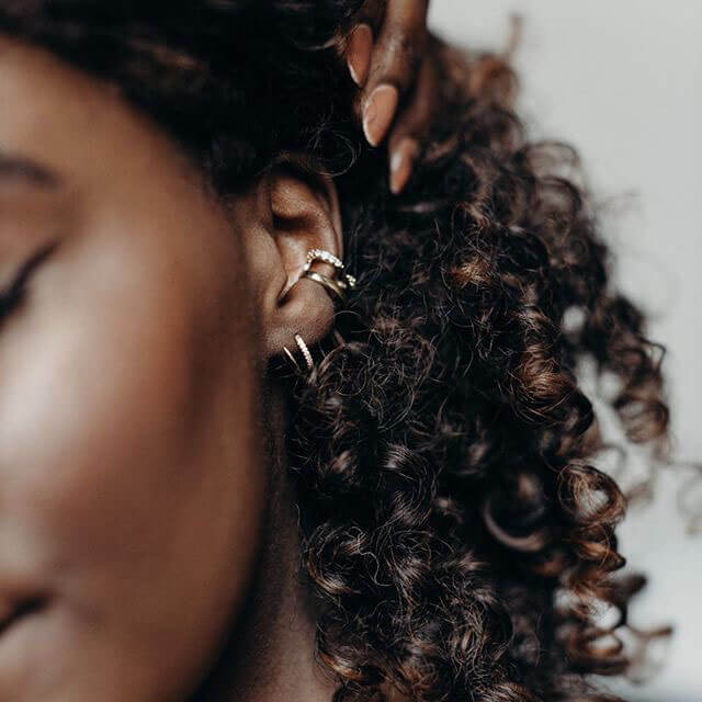 Comet Twirl Earrings in Gold Vermeil on model