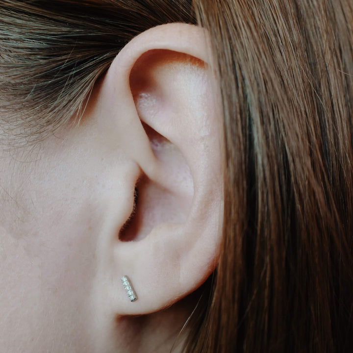 Pave Bar Studs in Titanium (Silver) on model