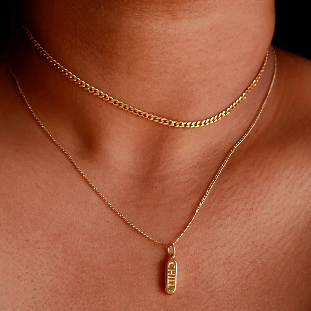 Chill Pill Charm Necklace on model (Gold)
