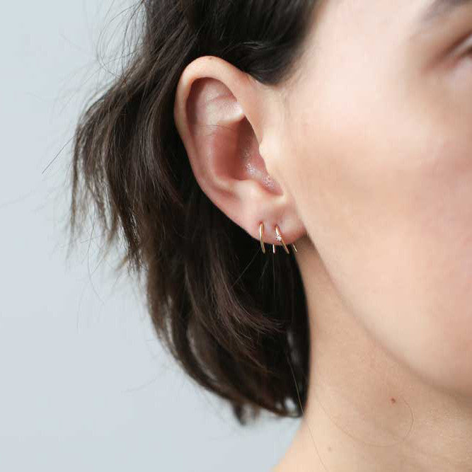 Large Whispering Star Open Hoop Earrings on model