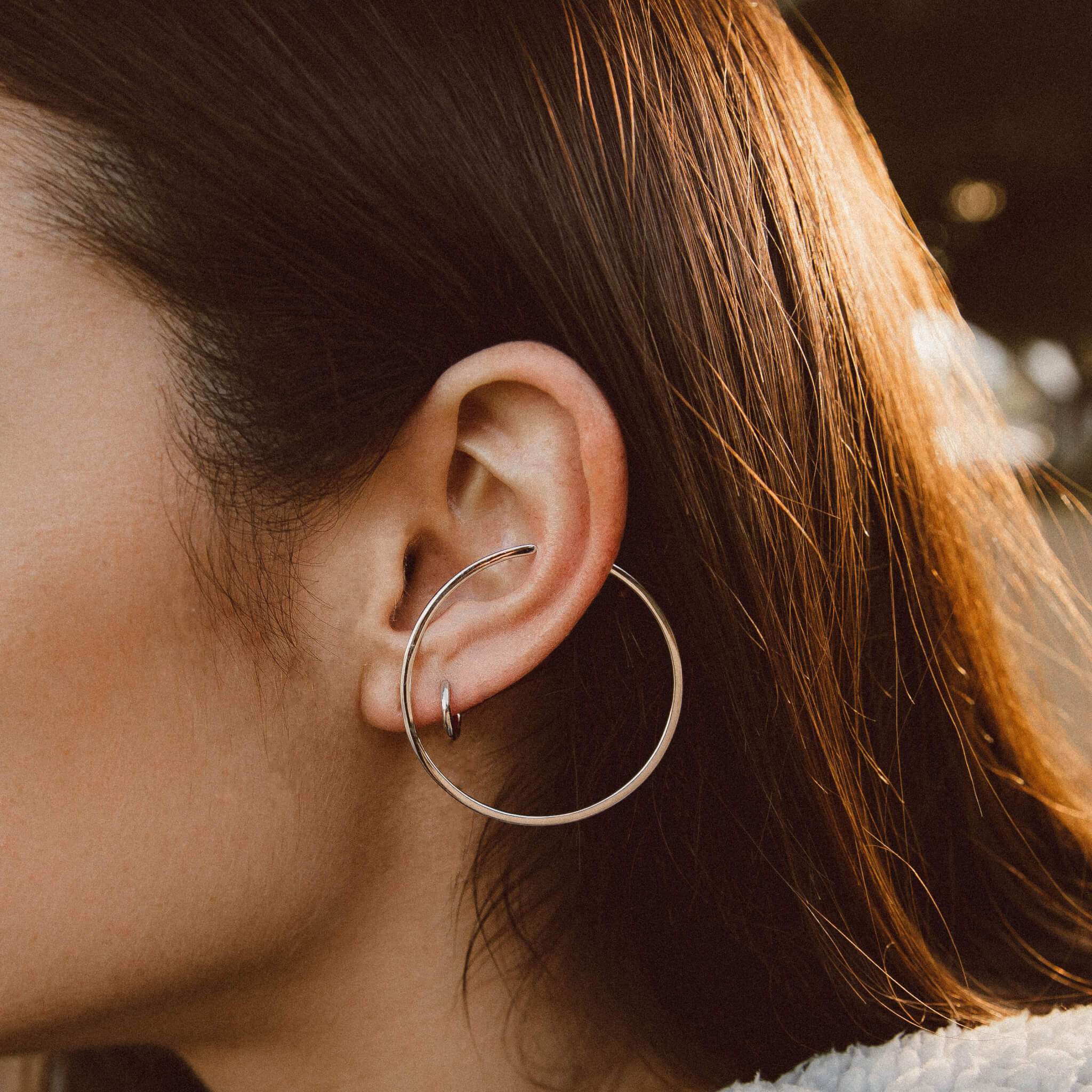 Large Illusion Hoops in Sterling Silver on model