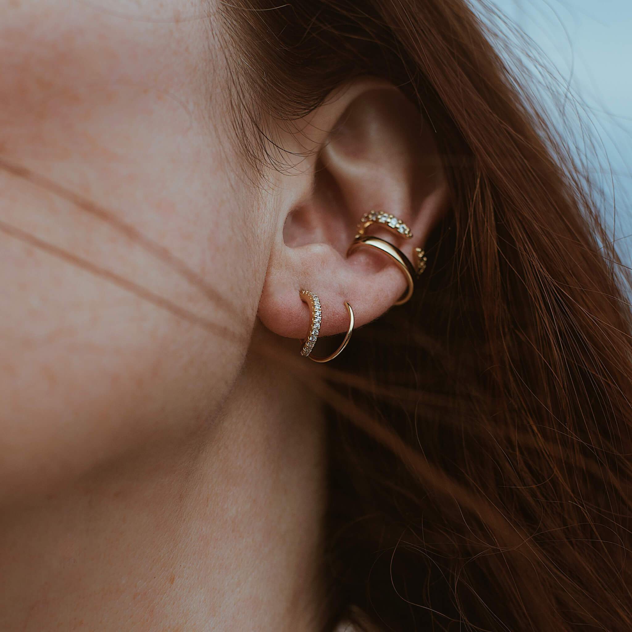 Comet Twirl Earrings on model