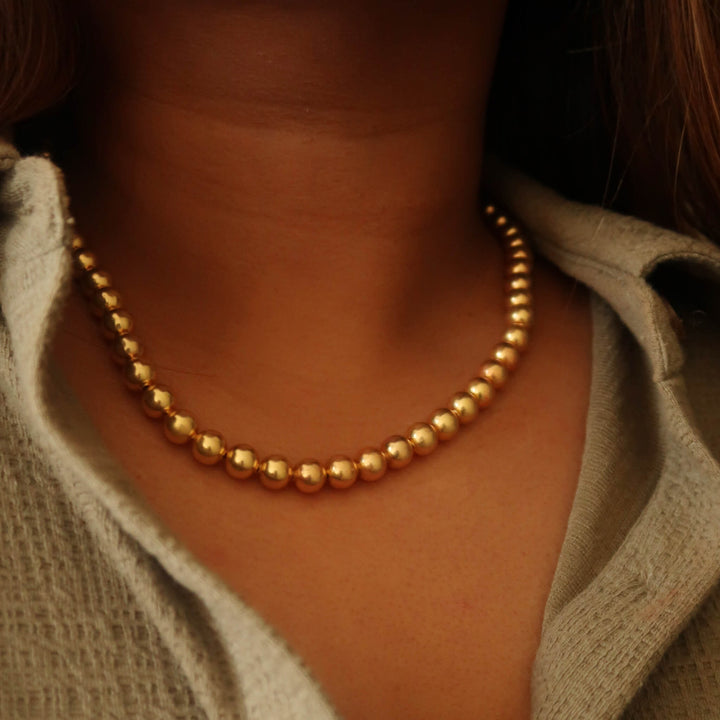 Industrial Pearl Necklace in Gold on model